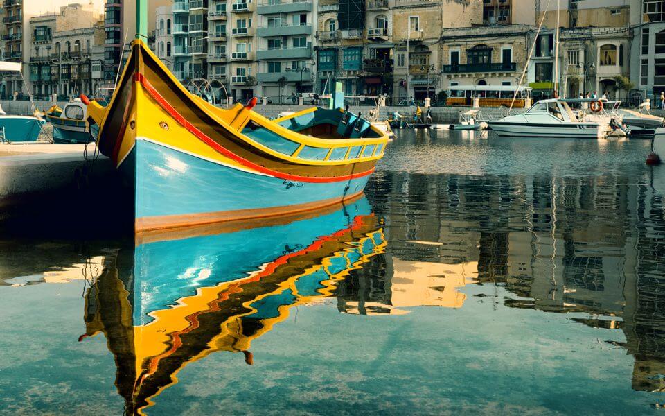 Maltese boat in St. Julian's Bay, Malta | Euroeduca ...